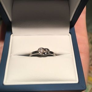 White gold and diamond infinity knot ring