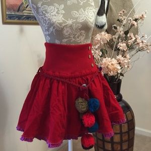 Red skirt or top with pompom. Used