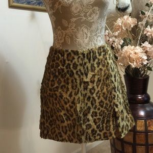 Bebe faux leopard mini skirt .
