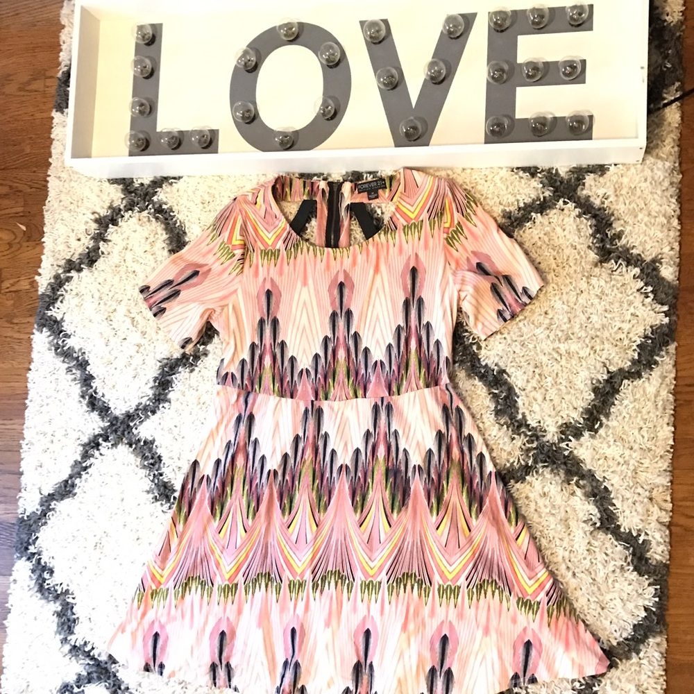 Pink dress with multi color print and back detail
