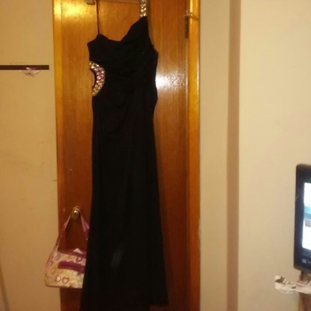 Black prom with crystals on the side of it