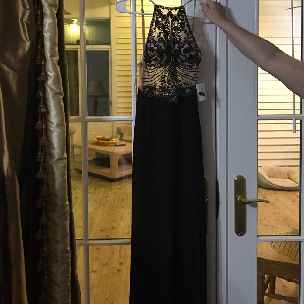 Black long dress with nude straps and nude front.