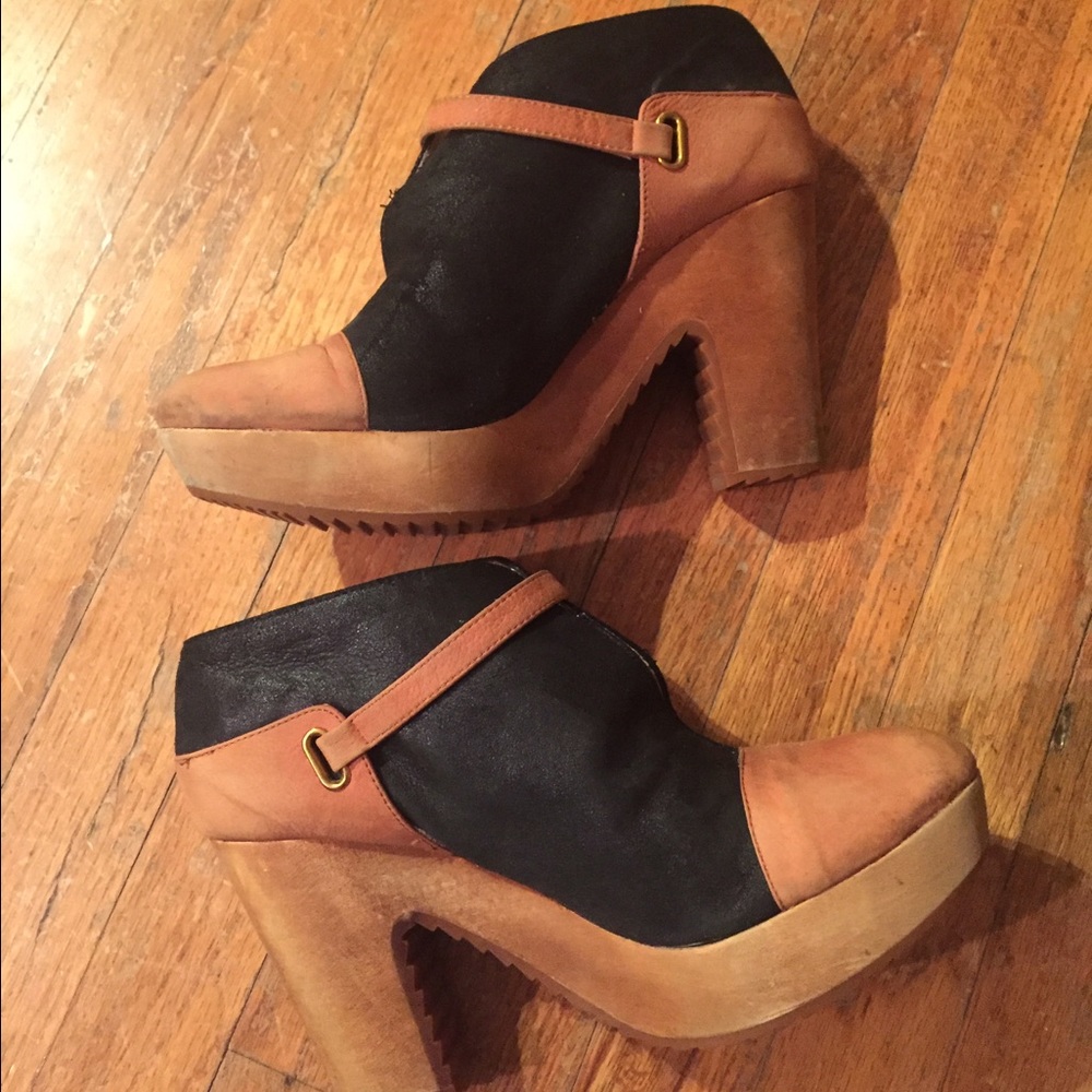 Platform, leather booties with wooden heel.