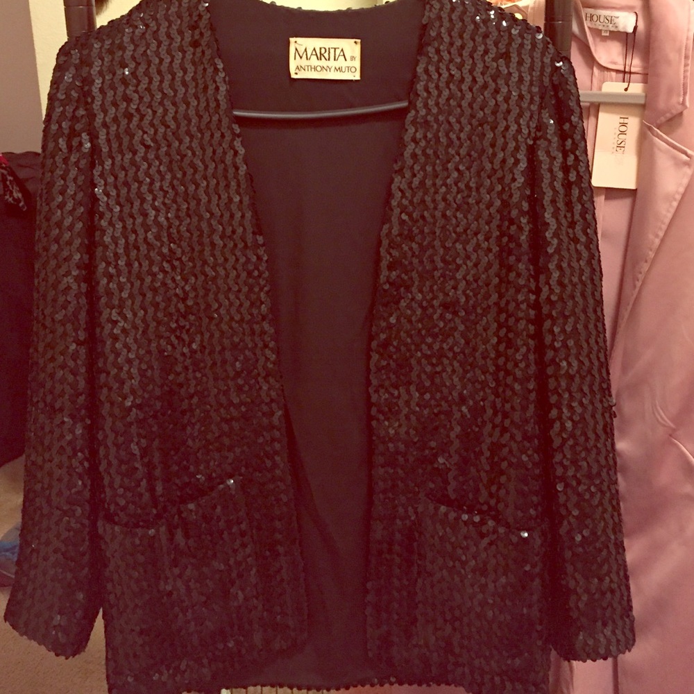 A black sequence high fashion blazer