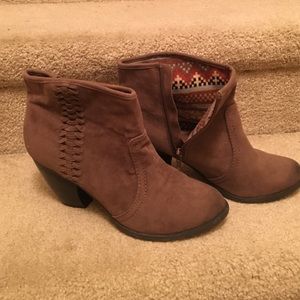 Brown suede booties with braided accent.