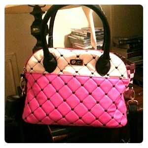 A black and pink and White Purse