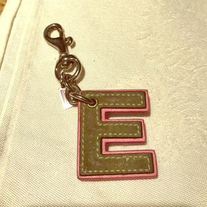 Green and pink suede Coach "E" letter keychain