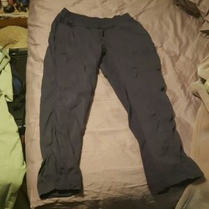 Purple lululemon studio crop.