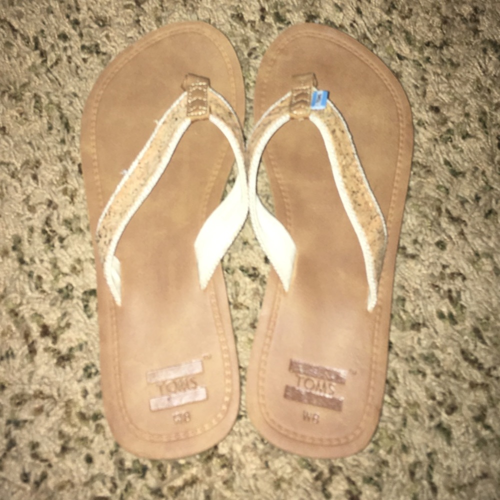 TOMS brown flip flops