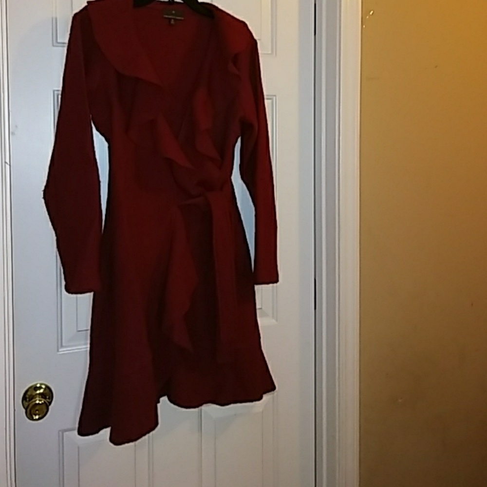 Red coat with ruffled collar and tie belt