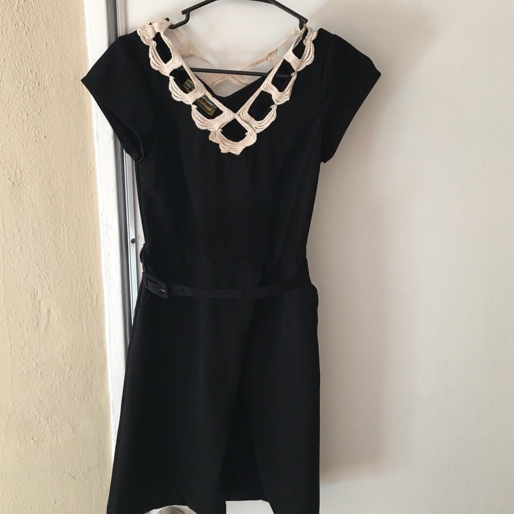 Black dress with a design around the neck