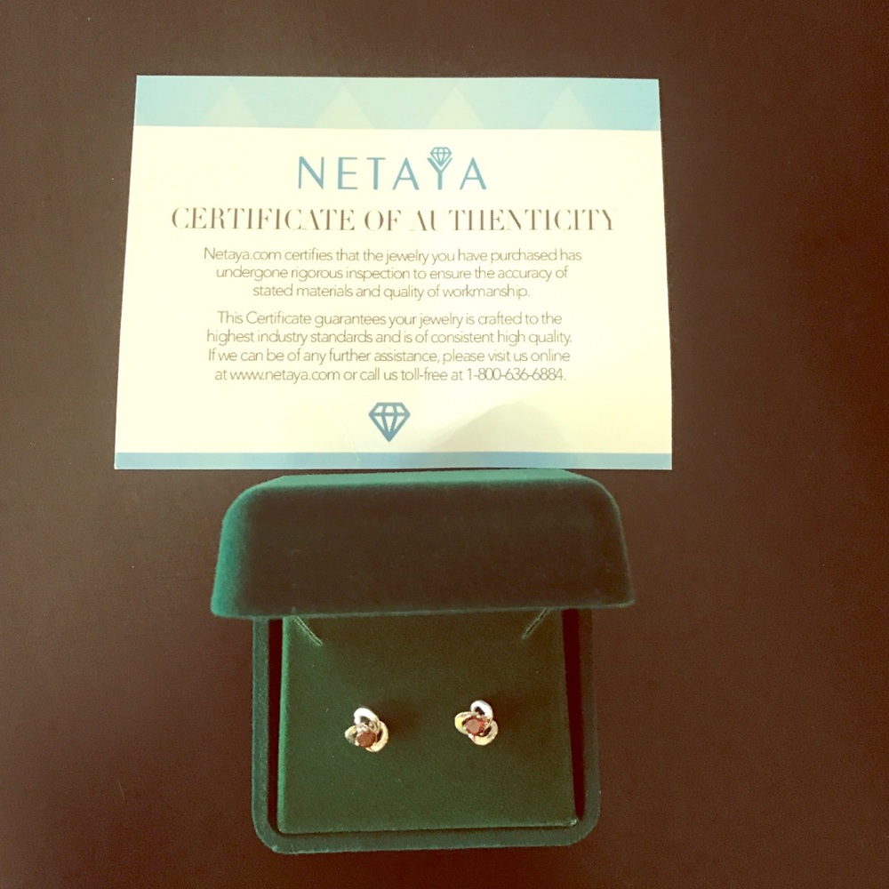 Brand new quarter carat, knot Garnet earrings!!