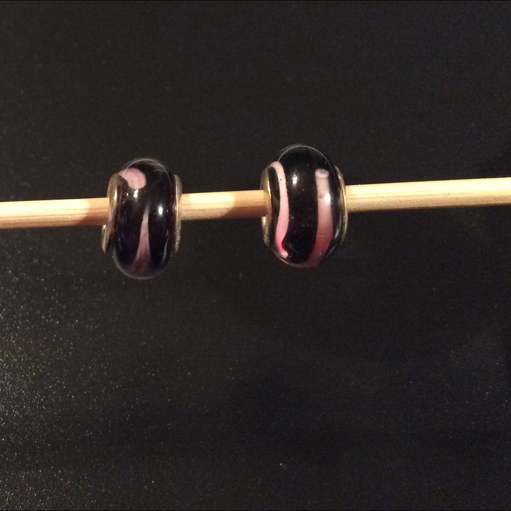 2 pink and black Murano beads