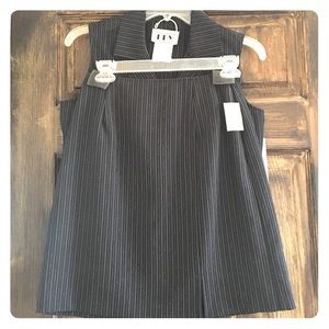 Matching vest and skirt - classic business attire.