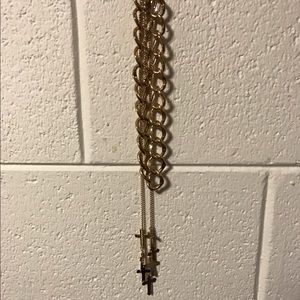Gold chain with additional cross necklace attached