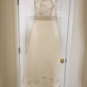 Unworn wedding gown with veil