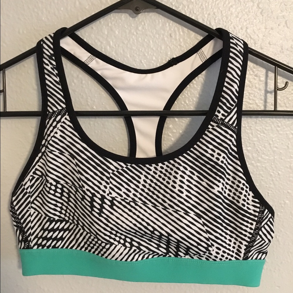 Black and white sports bra with a pop of teal