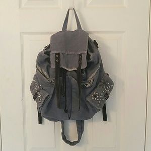Free People denim backpack with stud details