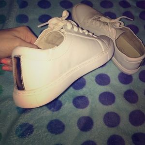 White gold striped sneakers.