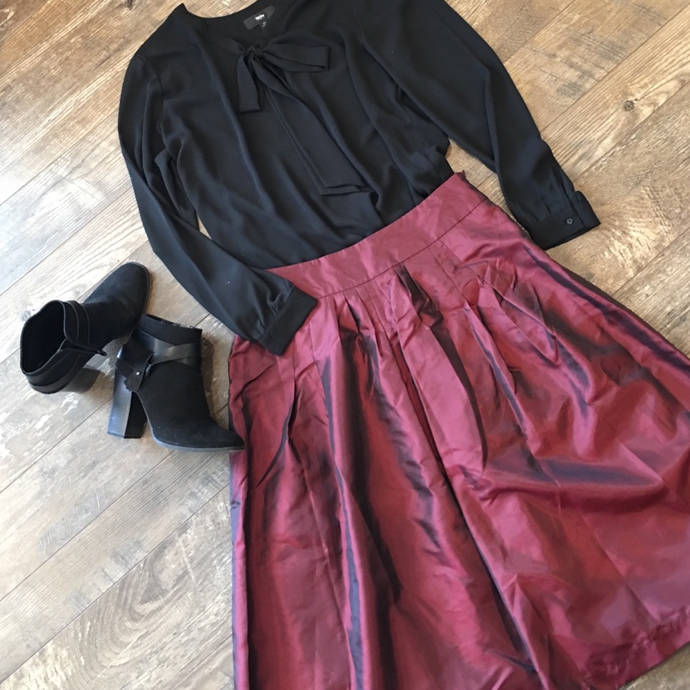 Burgundy taffeta high-waist skirt.