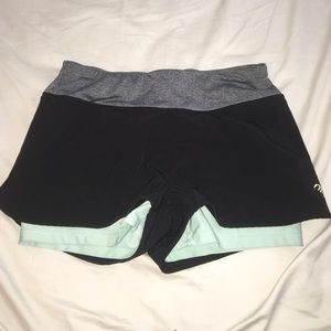 Black and teal running shorts