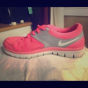 Neon orange Nike sneakers