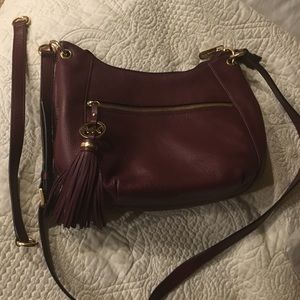 Michael Kors cross body purse Burgundy color