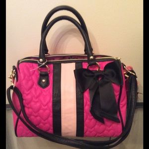 Pink black leather bag attractive color bag.