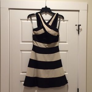 Tan and black cross front dress.