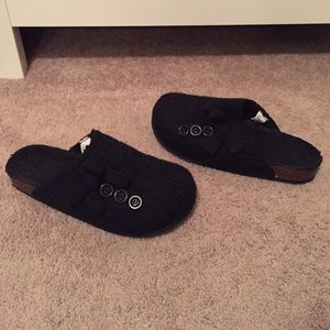 Black slip ons with buttons and bow