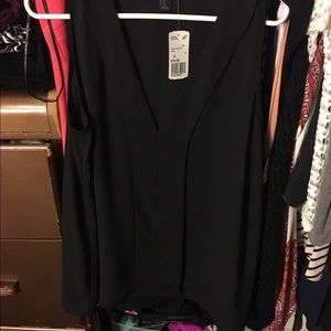 Two cute blouses with lower cut cleavage line.