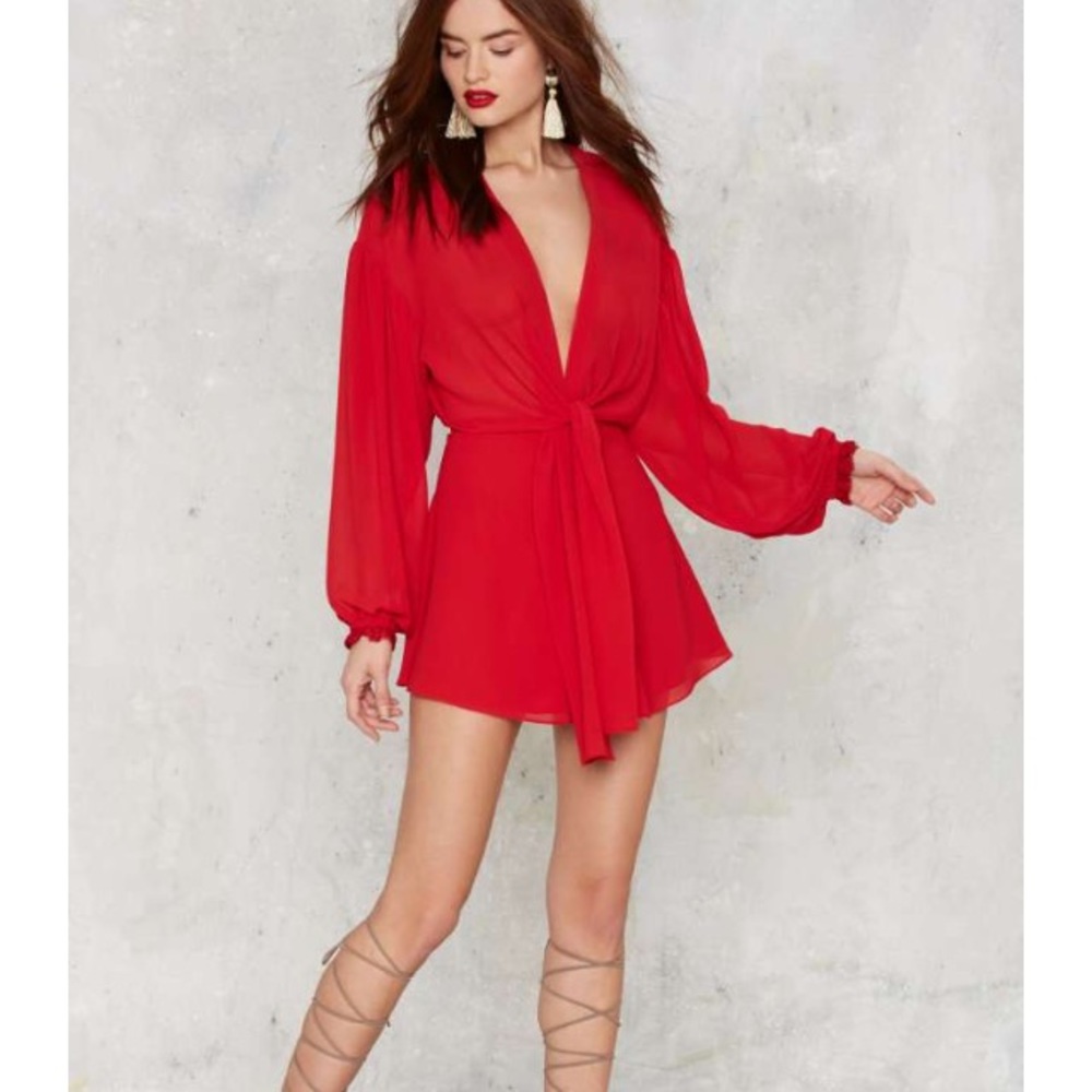 Neck plunging romantic red romper.