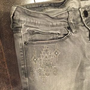 Grey tribal print skinny jeans