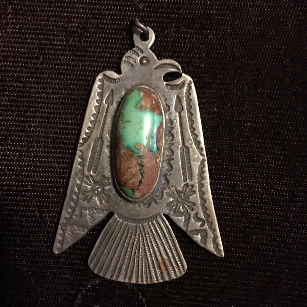 Turquoise and silver eagle pendant. No markings.