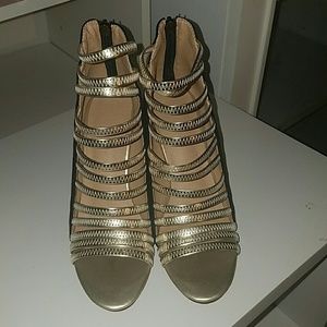 Black & gold gladiator heeled open-toe..red bottom