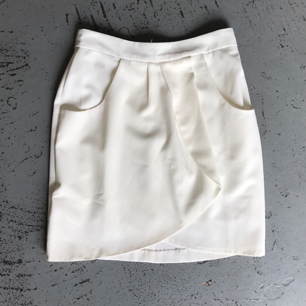 Tulip hem cream mini skirt