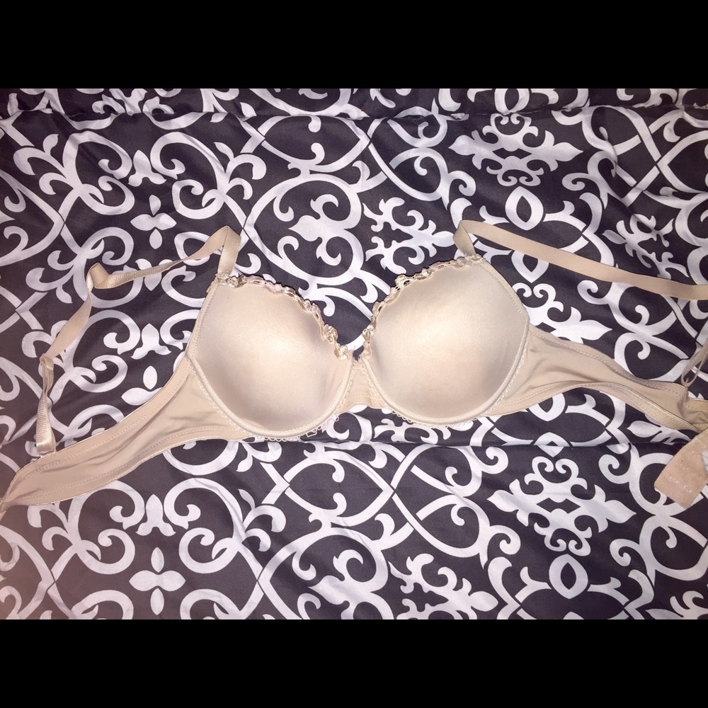 New cream colored bra, size 34B.