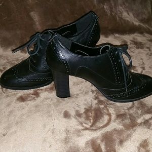 Black leather high heel shoes