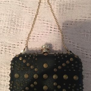 Skull black leather and gold metal clutch/ purse