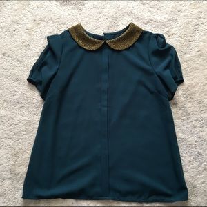 Boutique blouse in jade/gold.