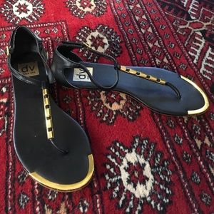 Dolce Vita black and gold flat thong sandals