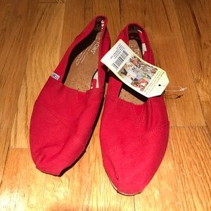 Never worn before red Toms!