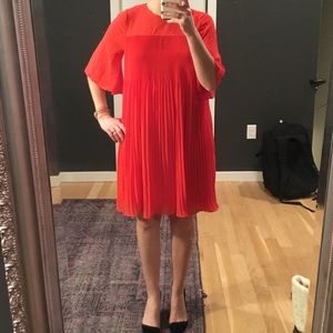 Orangey red pleated Anthropologie swing dress