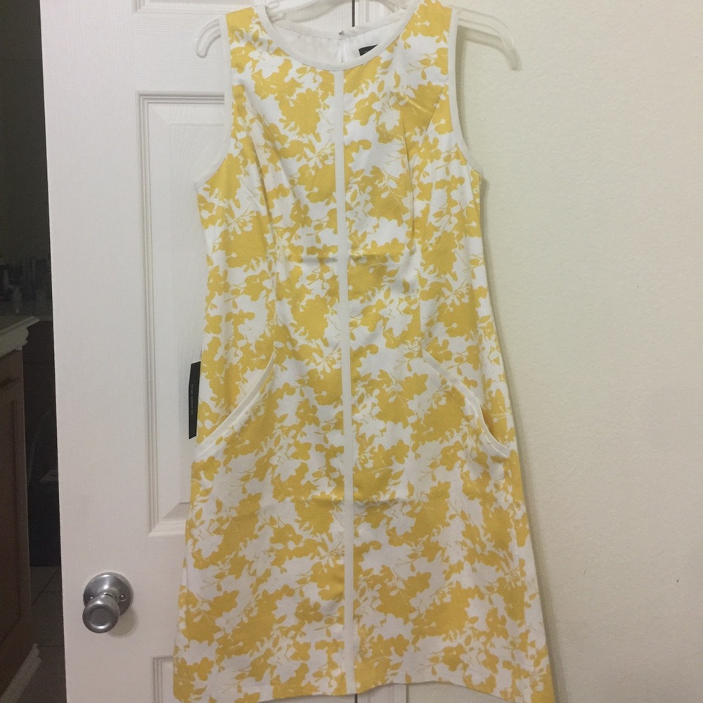 The limited  yellow print dress with pockets .
