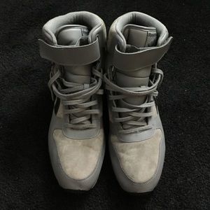 Hi top Reebok sneakers.