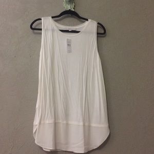 Ivory loft shell.  Sheer front/back tails.