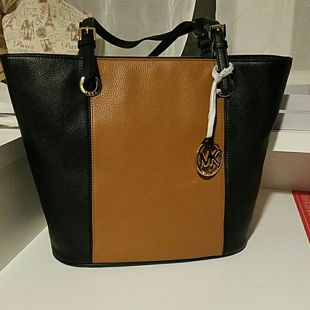 Michael Kors black and tan LG leather tote.