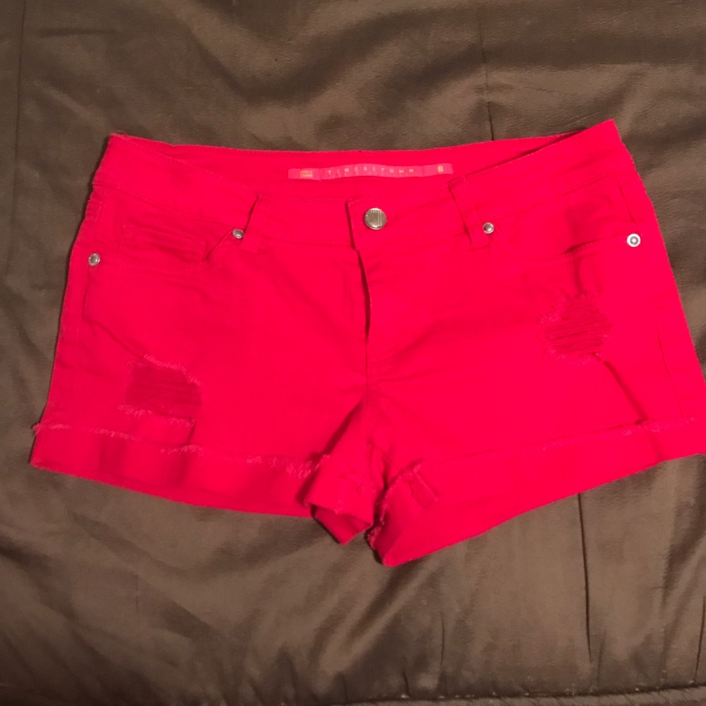 Distressed red denim shorts