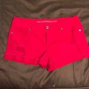 Distressed red denim shorts