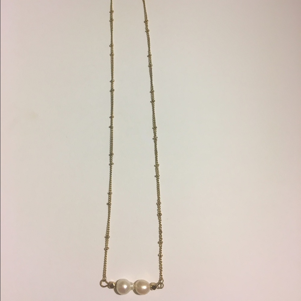 Gold plated pearl necklace.